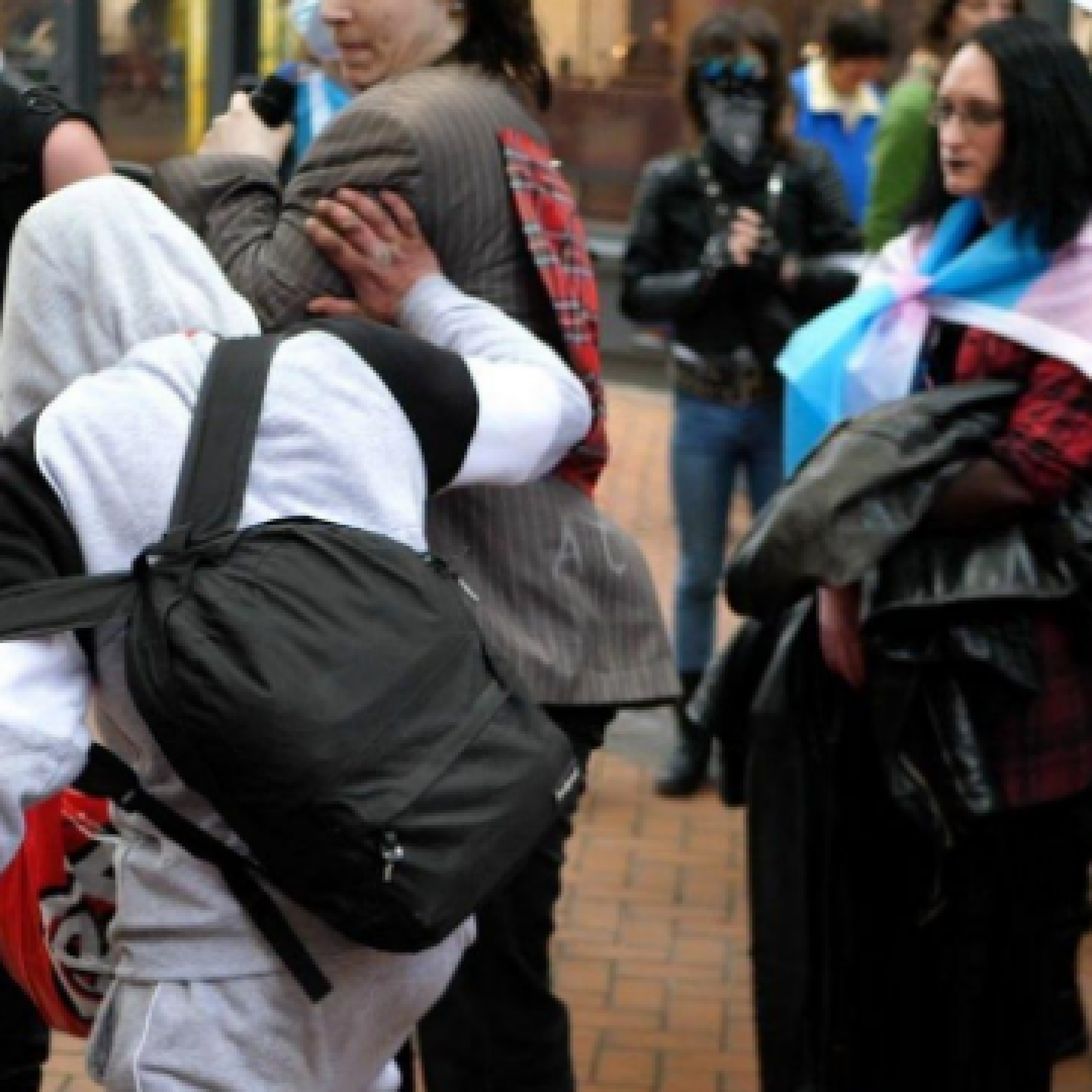 Activists say they were pushed and spat on, before local security staff intervened