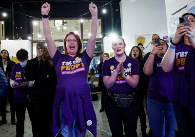 A supporter takes a selfie with Governor Gavin Newsom of California, one of five states to vote in support of abortion rights during the US midterm elections